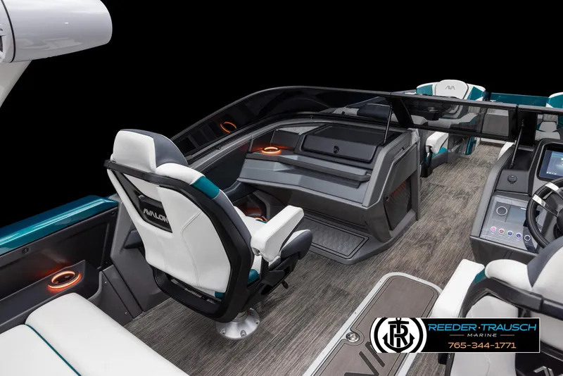 Slide: The Image of 2024 Avalon Excalibur VRB boat interior with modern dashboard and seating. - 7