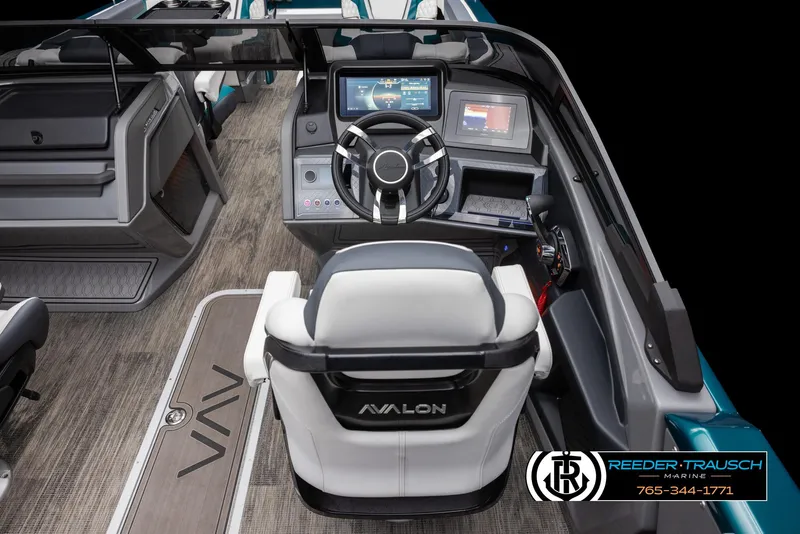 Slide: The Image of 2024 Avalon Excalibur VRB boat interior with advanced dashboard and steering wheel. - 8