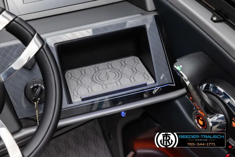 Slide: The Image of 2024 Avalon Excalibur VRB dashboard with wireless charging pad and steering wheel. - 9