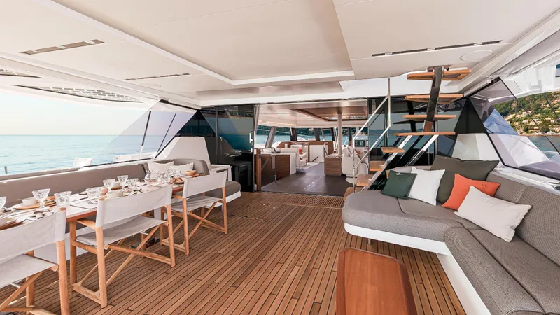Slide: The Image of Luxurious interior of 2025 Fountaine Pajot Thira 80 yacht with elegant dining and seating areas. - 10