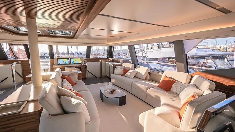 Slide: The Image of Luxurious interior of 2025 Fountaine Pajot Thira 80 yacht with elegant seating and modern design. - 13