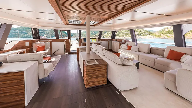 Slide: The Image of Luxurious interior of 2025 Fountaine Pajot Thira 80 yacht with elegant seating and scenic views. - 15