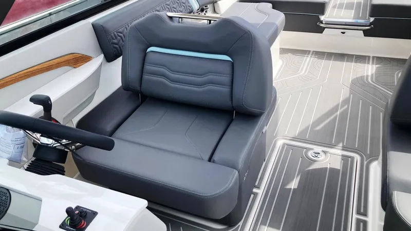 Slide: The Image of 2024 Regal LS9 boat interior with grey captain's seat and modern design. - 15