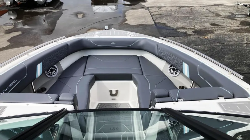 Slide: The Image of 2024 Regal LS9 boat interior with gray seating and modern design. - 19