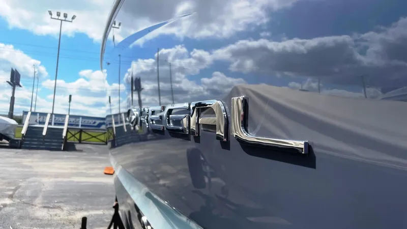 Slide: The Image of 2024 Regal LS9 boat with reflective logo under a blue sky. - 6