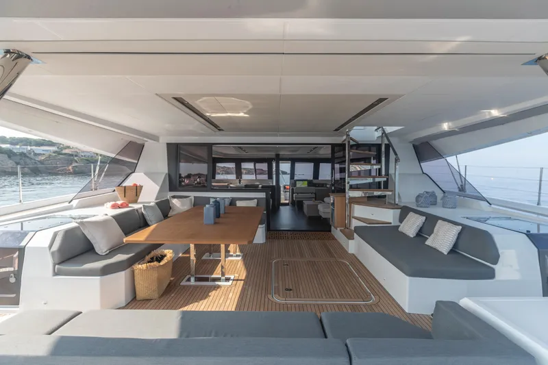 Slide: The Image of Luxurious interior of 2024 Fountaine Pajot Samana 59 catamaran with spacious seating and dining area. - 4