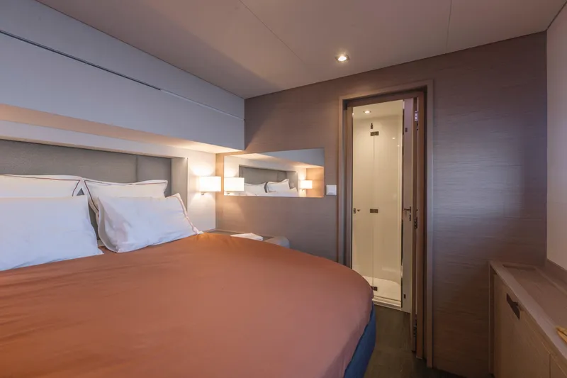 Slide: The Image of Luxurious bedroom on the 2024 Fountaine Pajot Samana 59 yacht with ensuite bathroom. - 8