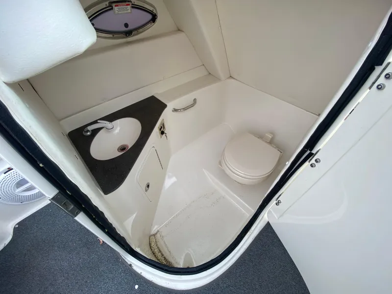 Slide: The Image of 2011 Sea Ray 300 Sundeck boat bathroom with sink and toilet. - 17