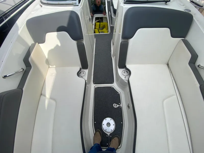Slide: The Image of 2011 Sea Ray 300 Sundeck interior with white and gray seating. - 21