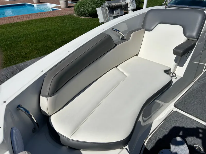 Slide: The Image of 2011 Sea Ray 300 Sundeck boat interior with white and gray seating. - 33