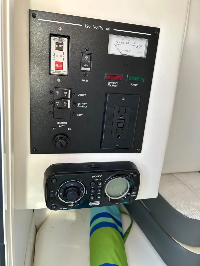 Slide: The Image of Control panel of a 2011 Sea Ray 300 Sundeck boat with Sony audio system. - 38