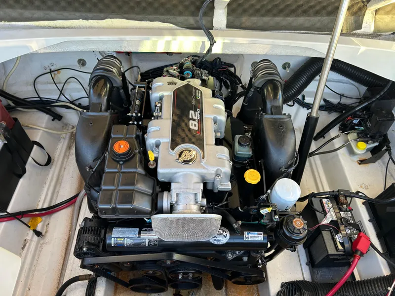 Slide: The Image of 2011 Sea Ray 300 Sundeck engine compartment, showcasing a well-maintained motor. - 39