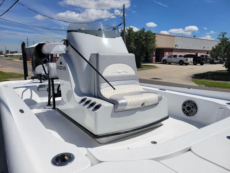 Slide: The Image of 2022 Turner Boatworks 2500 VS, sleek white design, docked under clear blue sky. - 10