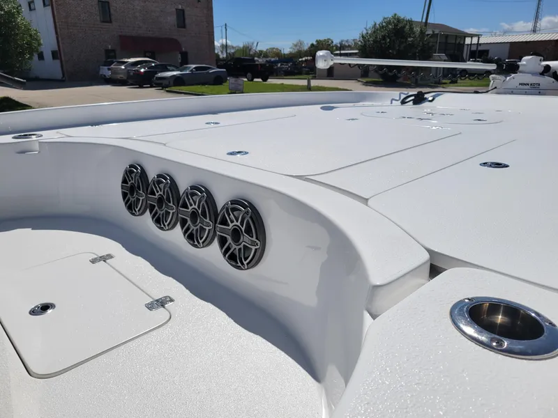 Slide: The Image of 2022 Turner Boatworks 2500 VS, white deck with built-in speakers and storage compartments. - 11