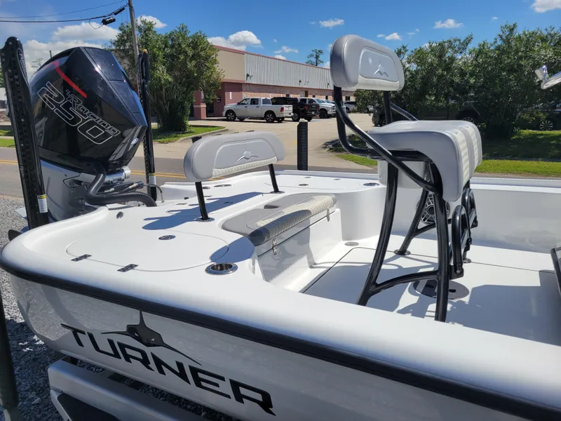 Slide: The Image of 2022 Turner Boatworks 2500 VS with 250 horsepower engine, white interior, and seating. - 13