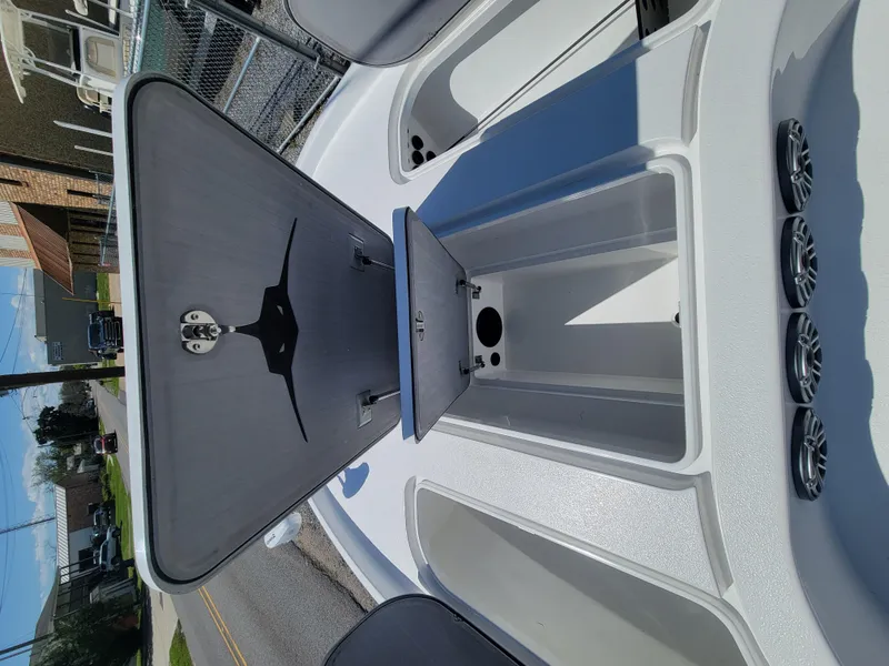 Slide: The Image of 2022 Turner Boatworks 2500 VS open storage compartment on deck. - 21