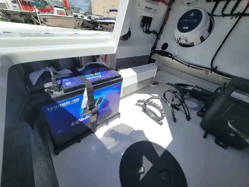 Slide: The Image of 2022 Turner Boatworks 2500 VS interior with battery and electrical components. - 24