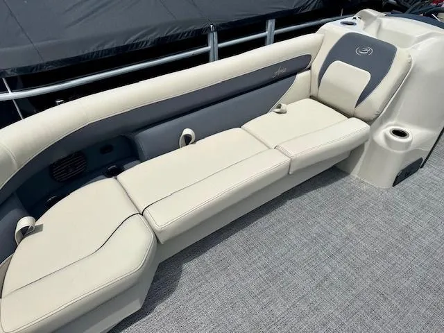 Slide: The Image of 2024 Barletta Aria 24QC boat interior with beige seating and gray accents. - 4