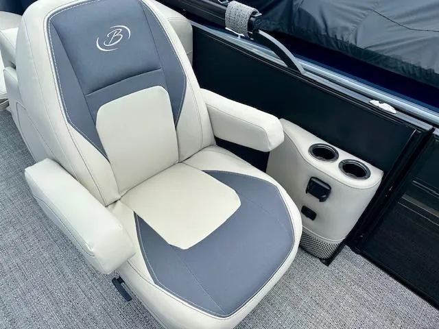 Slide: The Image of Barletta Aria 24QC 2024 captain's chair with cup holders and armrests on a boat. - 6