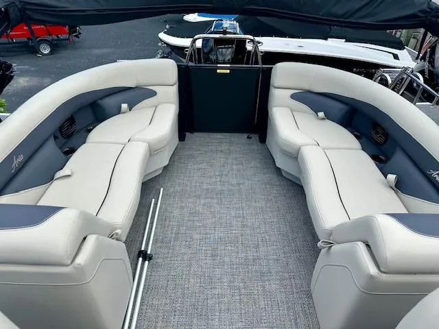 Slide: The Image of 2024 Barletta Aria 24QC pontoon boat interior with plush seating. - 7
