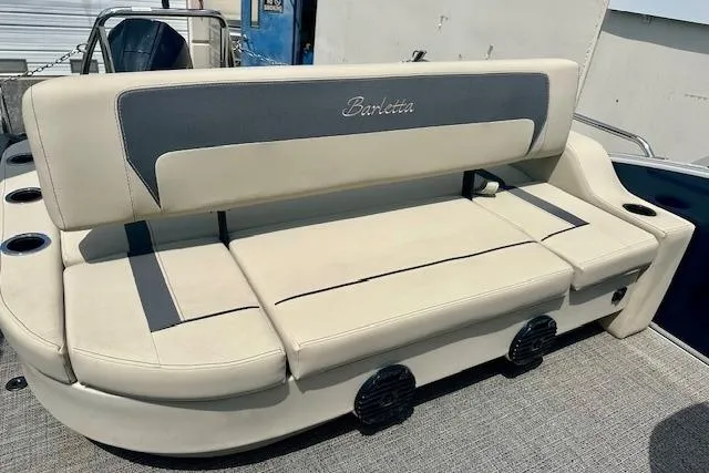 Slide: The Image of 2024 Barletta Aria 24UC boat seating with beige upholstery and cup holders. - 7