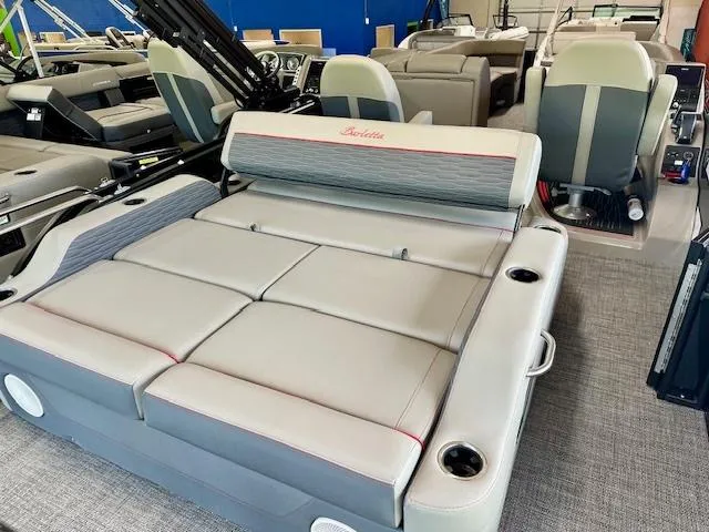 Slide: The Image of 2024 Barletta CORSA 25UC luxury pontoon boat interior with convertible seating. - 12