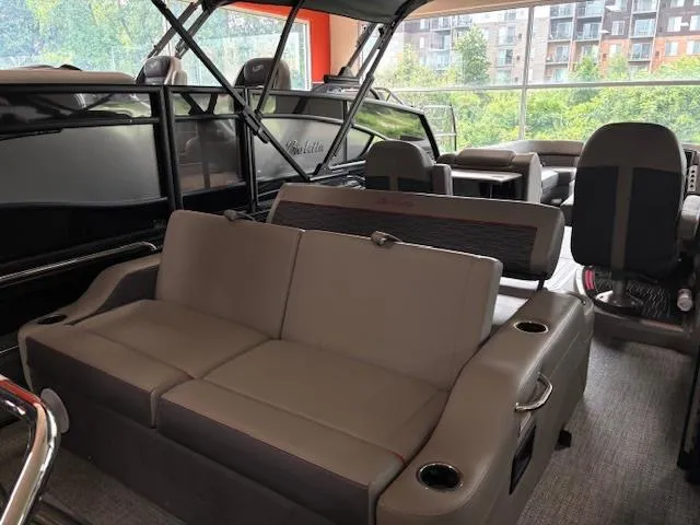 Slide: The Image of 2024 Barletta CORSA 25UC pontoon boat interior with comfortable seating and modern design. - 13