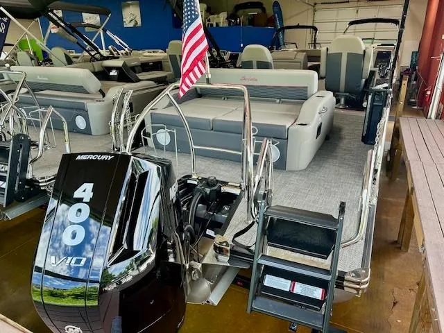 Slide: The Image of 2024 Barletta CORSA 25UC pontoon boat with Mercury 400 V10 engine in showroom. - 3