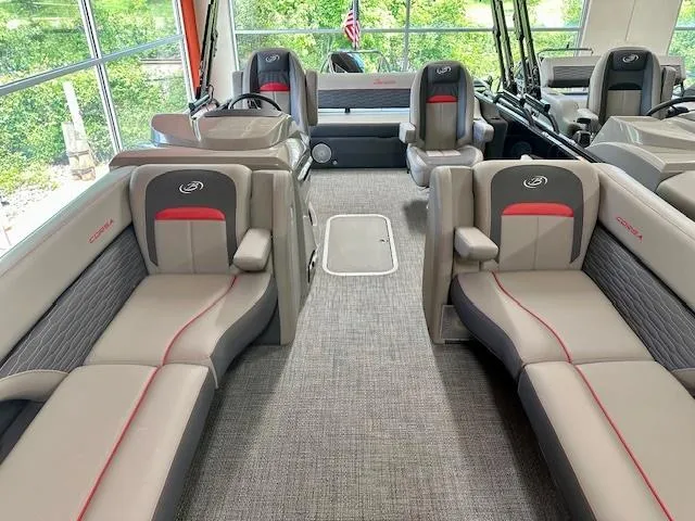Slide: The Image of 2024 Barletta CORSA 25UC pontoon boat interior with luxurious seating and modern design. - 4