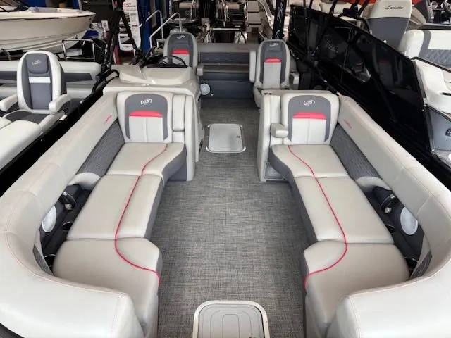 Slide: The Image of 2024 Barletta CORSA 25UC pontoon boat interior with gray seating and red accents. - 5