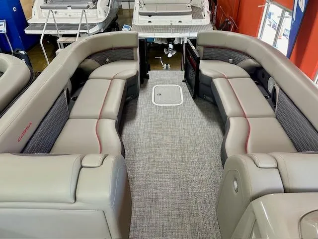 Slide: The Image of 2024 Barletta CORSA 25UC pontoon boat interior with luxurious seating and modern design. - 6
