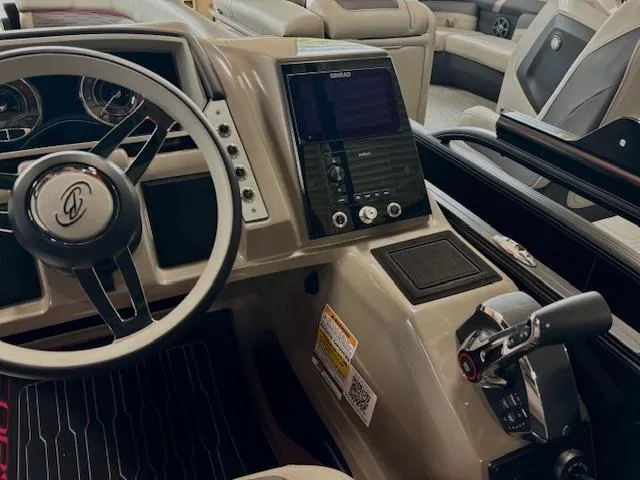 Slide: The Image of 2024 Barletta CORSA 25UC boat dashboard with steering wheel and control panel. - 9