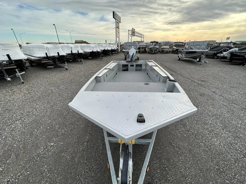 Slide: The Image of 2023 Smoker Craft Sportsman Pro 1866 boat in a dealership lot. - 2