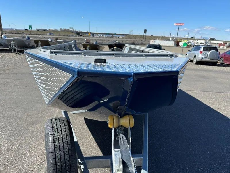 Slide: The Image of 2024 Smoker Craft Pro Sportsman 2072 boat on trailer, front view. - 2