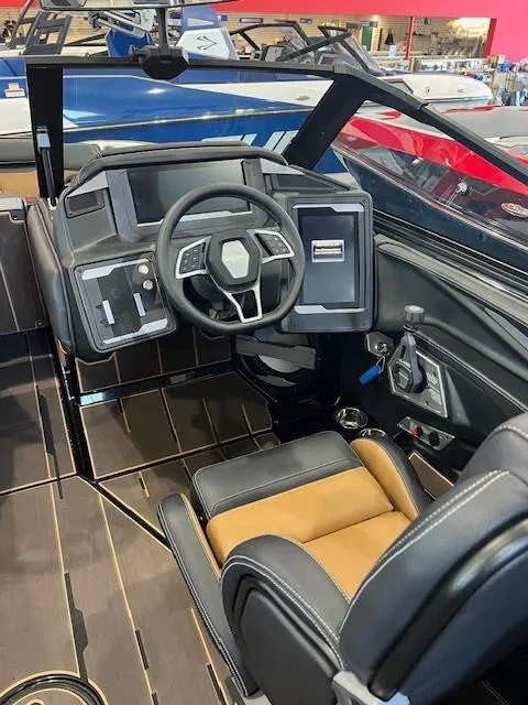 Slide: The Image of 2024 Supra SL boat cockpit with modern steering wheel and dashboard. - 12