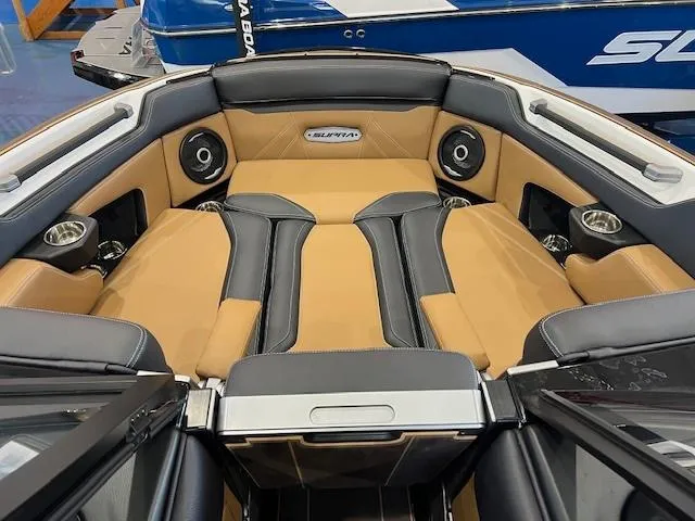 Slide: The Image of 2024 Supra SL boat interior with tan and black leather seats and built-in speakers. - 15