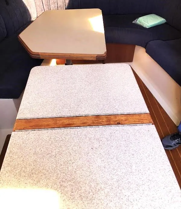 Slide: The Image of Interior of 1990 Hunter Vision 32 sailboat with seating and tables. - 21