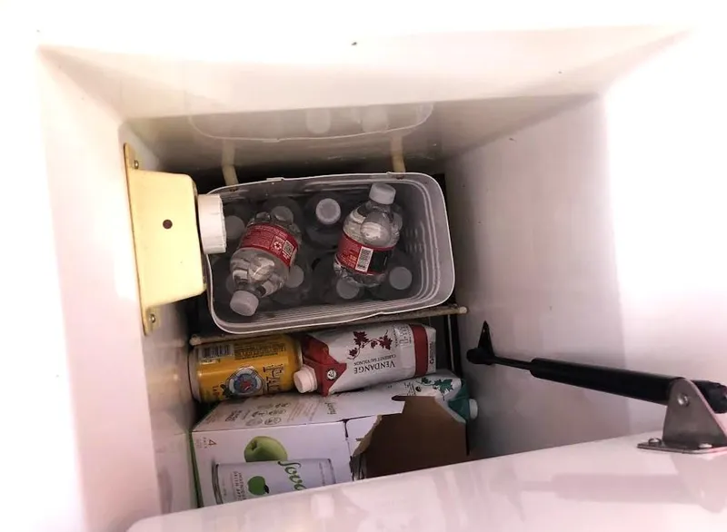 Slide: The Image of Cooler on 1990 Hunter Vision 32 sailboat with drinks and beverages stored inside. - 22