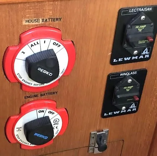 Slide: The Image of Control panel of a 1990 Hunter Vision 32 sailboat with battery switches. - 25