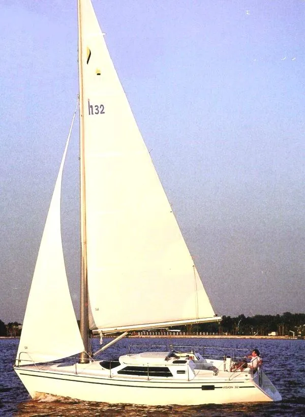 Slide: The Image of Sailboat Hunter Vision 32, 1990 model, sailing on calm waters under a clear sky. - 31