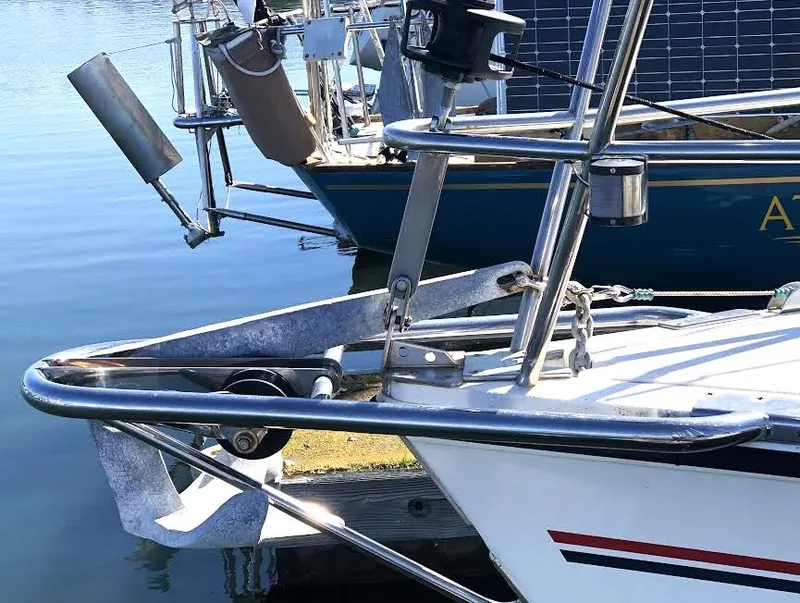 Slide: The Image of Bow of a 1990 Hunter Vision 32 sailboat with anchor and docked in marina. - 6