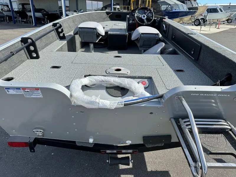 Slide: The Image of 2024 Starweld 16 Fusion SC Pro fishing boat interior with seating and steering console. - 11