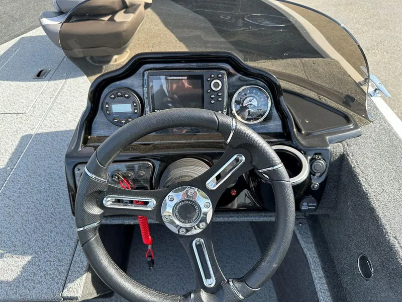 Slide: The Image of 2024 Starweld 16 Fusion SC Pro boat interior with steering console and storage compartments. - 4
