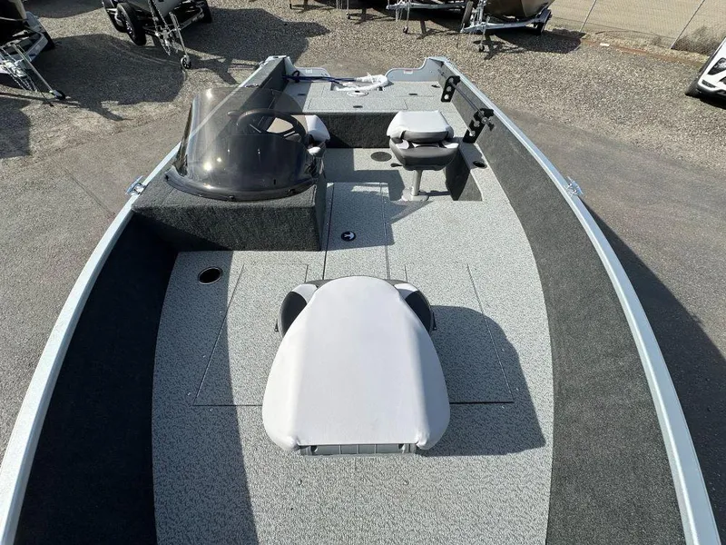 Slide: The Image of 2024 Starweld 16 Fusion SC Pro boat dashboard with steering wheel and controls. - 5