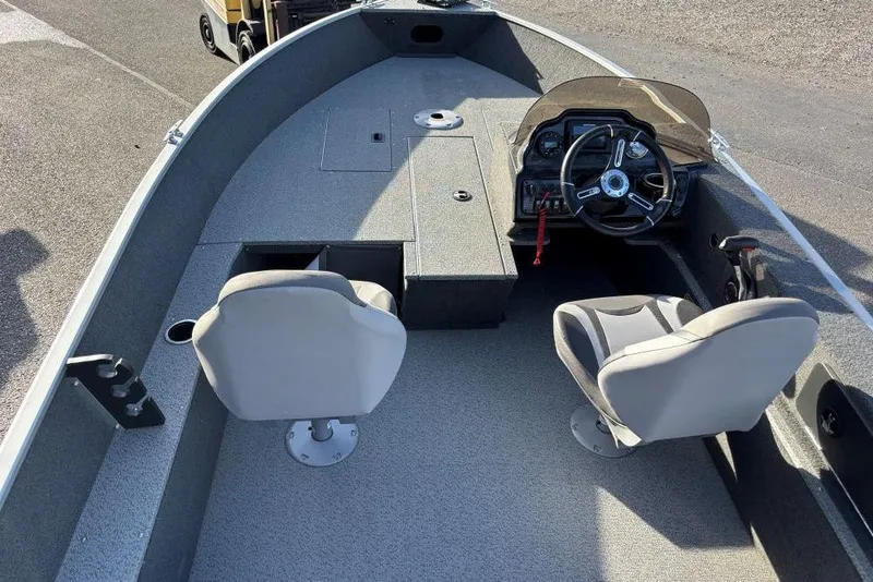 Slide: The Image of 2024 Starweld 16 Fusion SC Pro boat interior with dual seats and steering console. - 9