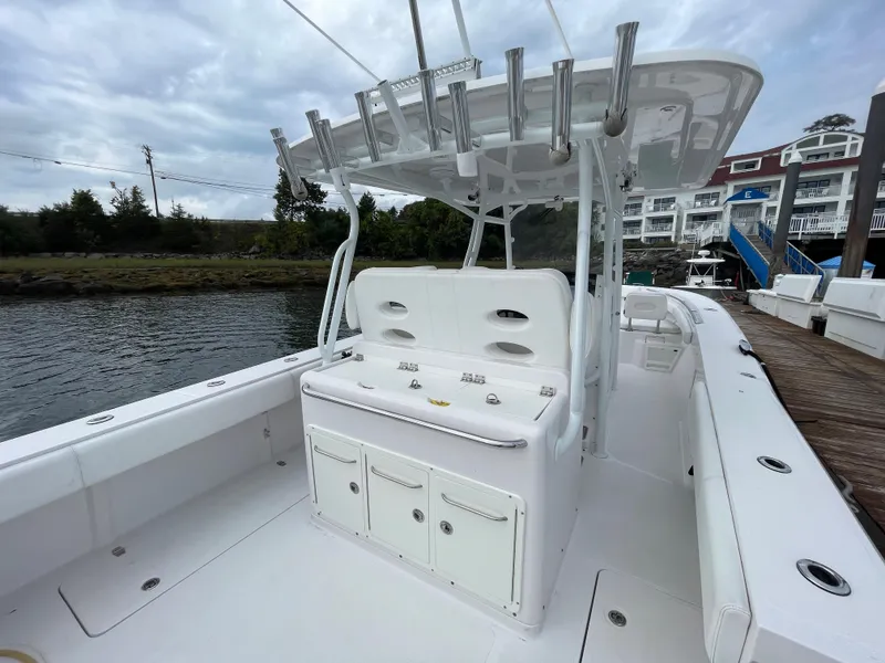 Slide: The Image of 2018 Southport 33 FE boat interior with rod holders and storage compartments. - 15