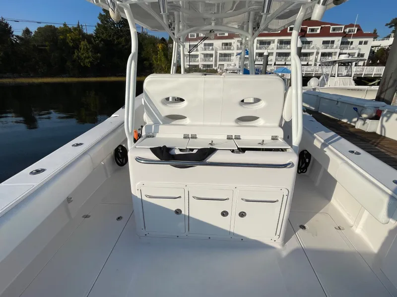 Slide: The Image of 2018 Southport 33 FE boat interior with seating and storage compartments. - 16