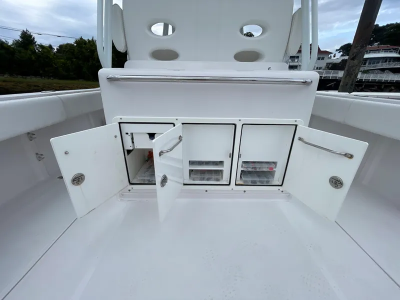 Slide: The Image of 2018 Southport 33 FE boat with open storage compartments. - 17