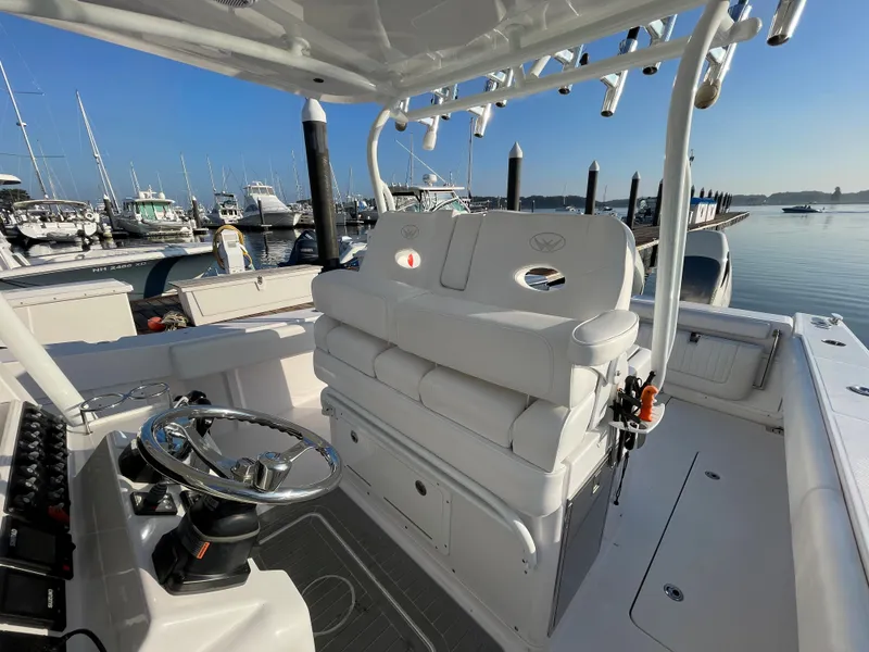 Slide: The Image of 2018 Southport 33 FE boat interior at a marina with multiple yachts. - 25