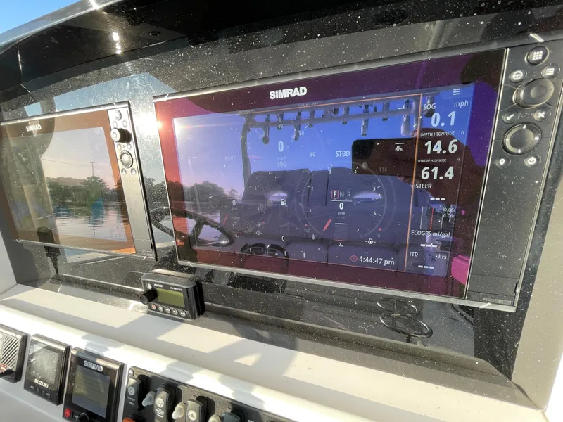 Slide: The Image of Control panel of a 2018 Southport 33 FE boat with Simrad navigation system. - 29